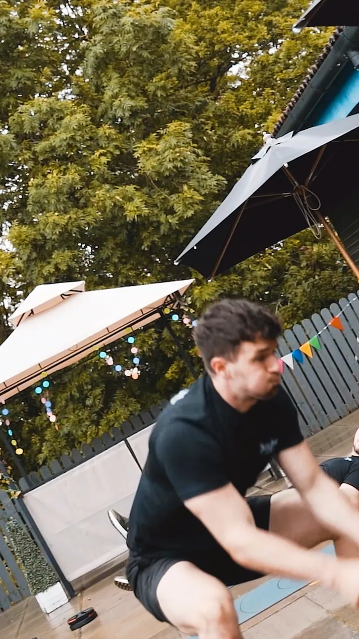 An outdoor battle-rope workout in the David Lloyd social film.
