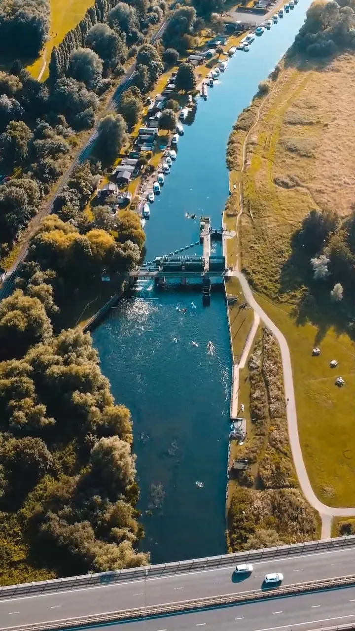 An aerial view of the river and green parkland in the Ferry Meadows campaign film.